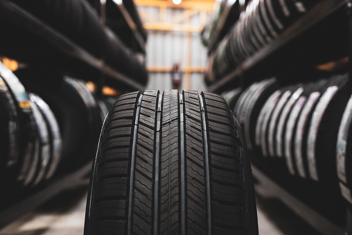 A new tire is placed on the tire storage rack in the car workshop. Be prepared for vehicles that need to change tires.