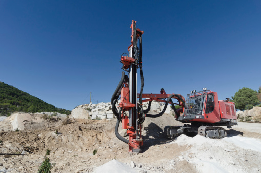 Closeup of an auger in a granite quarry