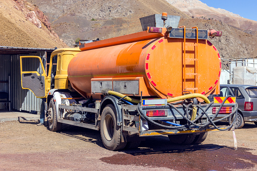 View of the retro water truck for dust in the construction site.